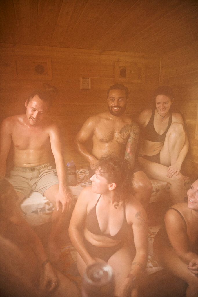 Group of friends in steaming cedar sauna near Leavenworth, Washington.