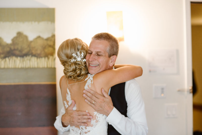 Bride hugging dad during Father/Daughter First Look