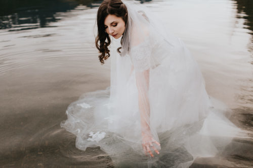 Bride in wedding dress in Rattlesnake Lake