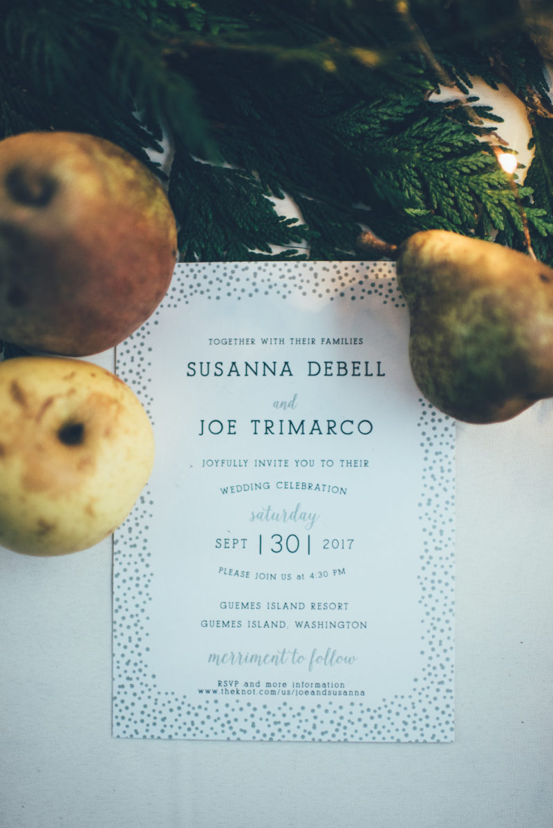 Fall wedding invitation styled with cedar and fruit pears